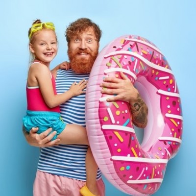 joyous-red-haired-family-have-fun-coastline-pleased-cheerful-bearded-dad-holds-little-girl-inflated-swim-ring_273609-29732 (2).jpg